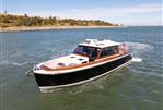 Boston Boatworks Daychaser 48 - 2024 Boston Boatworks Daychaser 48 cruising on open water.