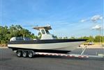 Custom Leblanc CC - 2003 Custom Leblanc CC boat on trailer, parked outdoors under clear blue sky.