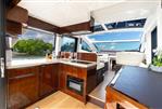 Galeon 47 Sky - Luxurious interior of 2022 Galeon 47 Sky yacht with modern kitchen and scenic views.