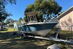 Scout 215 XSF - 2018 Scout 215 XSF boat on trailer in residential yard.