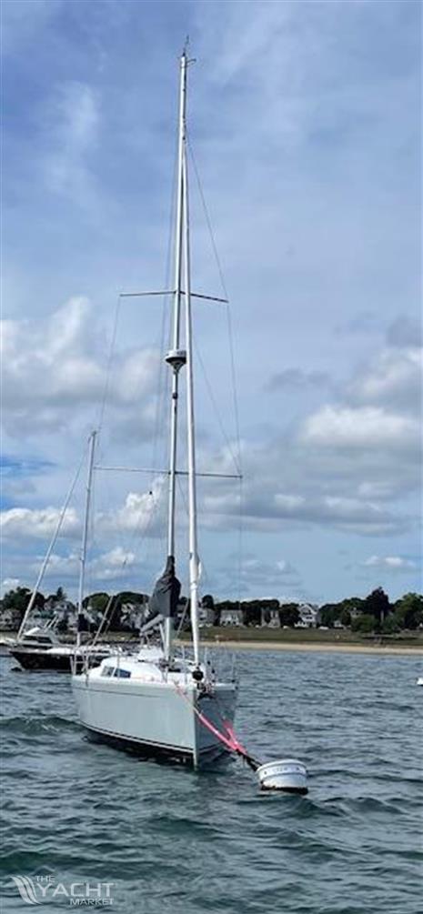 Hanse 315 - Sailboat Hanse 315, 2023 model, anchored in calm waters under a cloudy sky.