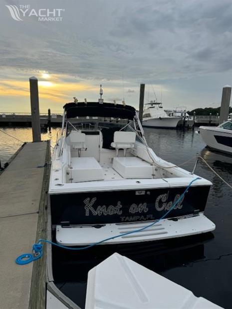 Blackfin 29 Combi - 1992 Blackfin 29 Combi boat docked at sunset in Tampa marina.