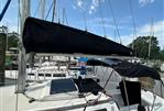 S2 9.2A - 1982 S2 9.2A sailboat docked, featuring covered boom and cockpit, with clear blue sky.