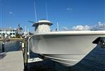 Yellowfin 36 Offshore - 2016 Yellowfin 36 Offshore boat docked by waterfront under clear blue sky.