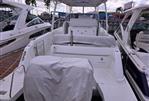 Jeanneau Leader 10.5 - 2018 Jeanneau Leader 10.5 boat docked, rear view with covered seating and equipment.