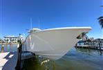 Yellowfin 36 Offshore - 2016 Yellowfin 36 Offshore boat docked by waterfront homes.