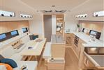 Hanse 510 - Modern interior of 2023 Hanse 510 yacht with spacious seating and kitchen area.