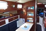 Endeavour 32 - Interior of 1979 Endeavour 32 sailboat with wooden furnishings and cozy seating area.