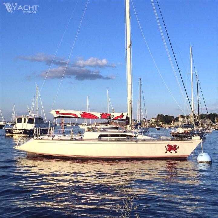 Farr 37 - 1983 Farr 37 sailboat anchored in a serene marina.
