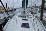 Beneteau 393 - 2003 Beneteau 393 sailboat docked at a marina, view of the deck and rigging.