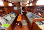 Bristol 38.8 - 1982 Bristol 38.8 sailboat interior with wooden finish and cozy seating area.