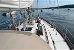 Bristol 38.8 - 1982 Bristol 38.8 sailboat deck with rigging and calm waters in the background.