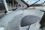 Regal Commodore 3560 IB - 2005 Regal Commodore 3560 IB boat interior with curved seating and table.