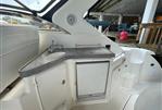 Regal Commodore 3560 IB - 2005 Regal Commodore 3560 IB boat interior with sink and storage.