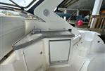 Regal Commodore 3560 IB - 2005 Regal Commodore 3560 IB boat interior with kitchenette and sink.