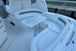 Sea Ray 340 Sundancer - 2006 Sea Ray 340 Sundancer boat interior with white seating and table.