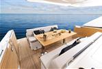 Jeanneau DB 43 - Luxury Jeanneau DB 43 yacht deck with dining setup, 2024 model.
