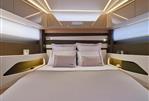 Jeanneau DB 43 - Luxurious bedroom interior of 2024 Jeanneau DB 43 yacht with modern lighting.