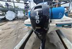 Bayliner VR5 - 2022 Bayliner VR5 boat with a 150 HP outboard motor in a storage facility.