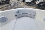 Bayliner VR5 - 2022 Bayliner VR5 boat interior with white seating and speakers.