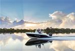 Bayliner Trophy 20 CC - 2023 Bayliner Trophy 20 CC boat cruising on a serene lake at sunset.