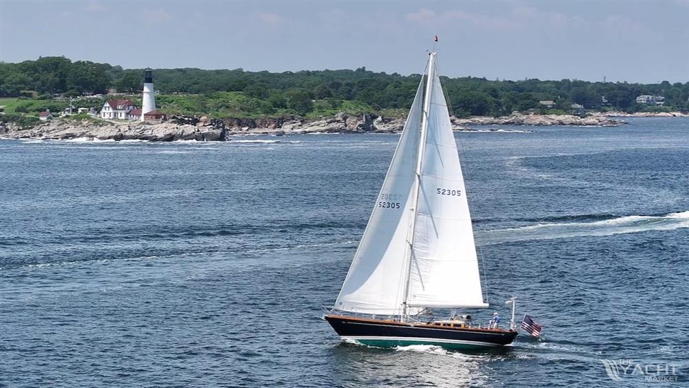 Lyman-Morse Sparkman &amp; Stephens Sloop - 2004 Lyman-Morse Sparkman &amp; Stephens Sloop sailing near a coastal lighthouse.