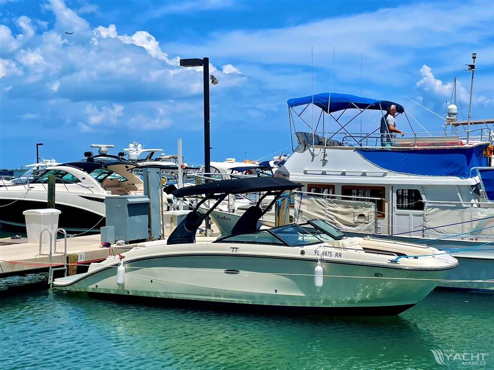 Sea Ray 270 SDX - 2018 Sea Ray 270 SDX docked at a marina on a sunny day.