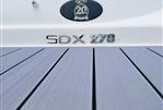 Sea Ray 270 SDX - 2018 Sea Ray 270 SDX boat deck with model emblem.