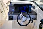 Sea Ray 270 SDX - 2018 Sea Ray 270 SDX boat dashboard with steering wheel and control panel.