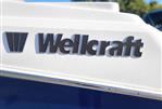 Wellcraft 242 Fisherman - 2023 Wellcraft 242 Fisherman boat logo on white and blue hull.