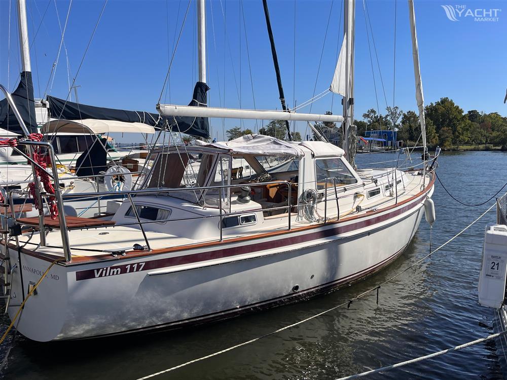 Vilm 117 - 2006 Vilm 117 sailboat docked at a marina on a sunny day.