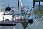 Vilm 117 - Close-up of the bow of a 2006 Vilm 117 sailboat docked by the water.