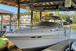 Sea Ray 340 Sundancer - 2002 Sea Ray 340 Sundancer docked under a covered marina.