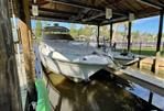 Sea Ray 340 Sundancer - 2002 Sea Ray 340 Sundancer docked under covered marina.