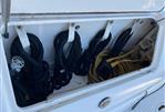 Sea Ray 340 Sundancer - Storage compartment on a 2002 Sea Ray 340 Sundancer with ropes and electrical cables.