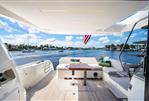 Prestige 520 Fly - Luxury yacht Prestige 520 Fly 2020 model, spacious deck with seating, table, and scenic water view.