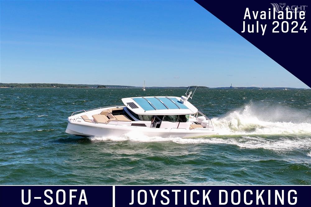 Axopar 45 - 2024 Axopar 45 boat cruising on water, featuring U-Sofa and joystick docking, available July 2024.