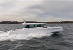 Axopar 45 - 2024 Axopar 45 boat cruising on open water.