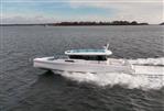 Axopar 45 - 2024 Axopar 45 boat cruising on open water.