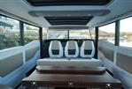 Axopar 45 - Interior of 2024 Axopar 45 boat with modern seating and panoramic windows.