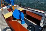 Crocker Yawl - 1930 Crocker Yawl sailboat deck with wooden finishes and blue covers.