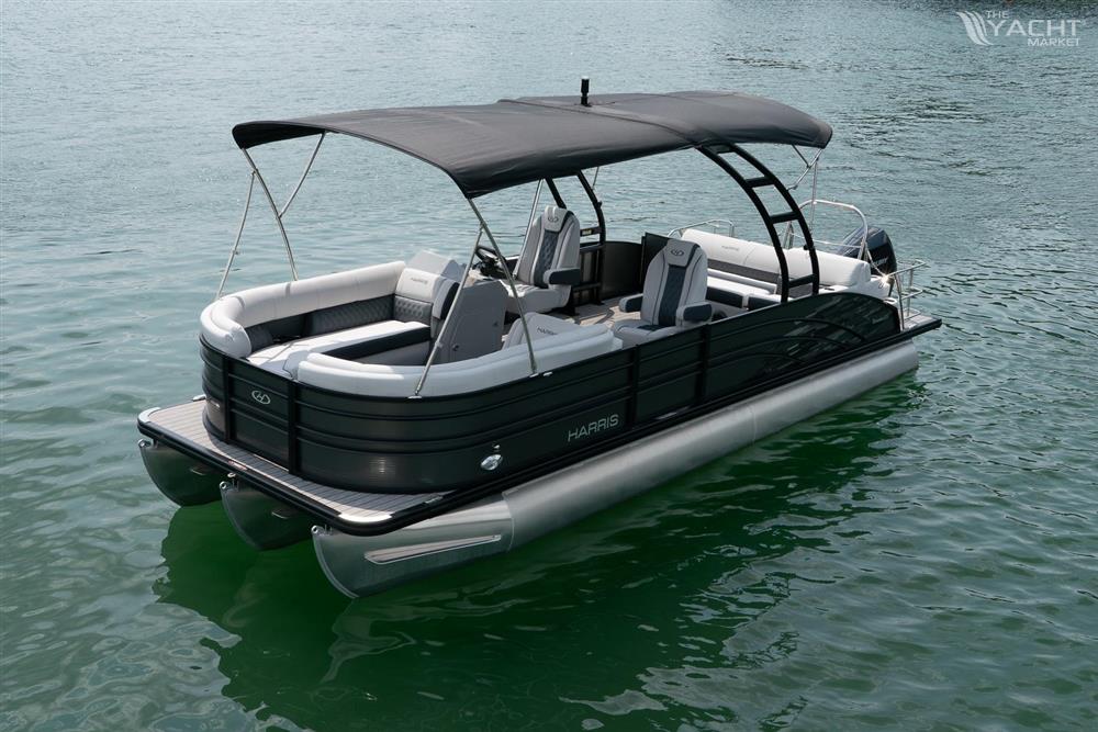 Harris 250 Sunliner Sport - 2023 Harris 250 Sunliner Sport pontoon boat on water with black canopy.