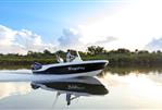 Bayliner Trophy 20 CC - 2023 Bayliner Trophy 20 CC boat cruising on calm water.