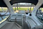 Sea Ray 320 Sundancer - Interior of 2006 Sea Ray 320 Sundancer yacht with white seating and covered dashboard.