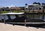 Chaparral 300 OSX - 2019 Chaparral 300 OSX docked by waterfront homes.