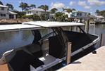 Chaparral 300 OSX - 2019 Chaparral 300 OSX boat docked in a residential canal with modern homes.