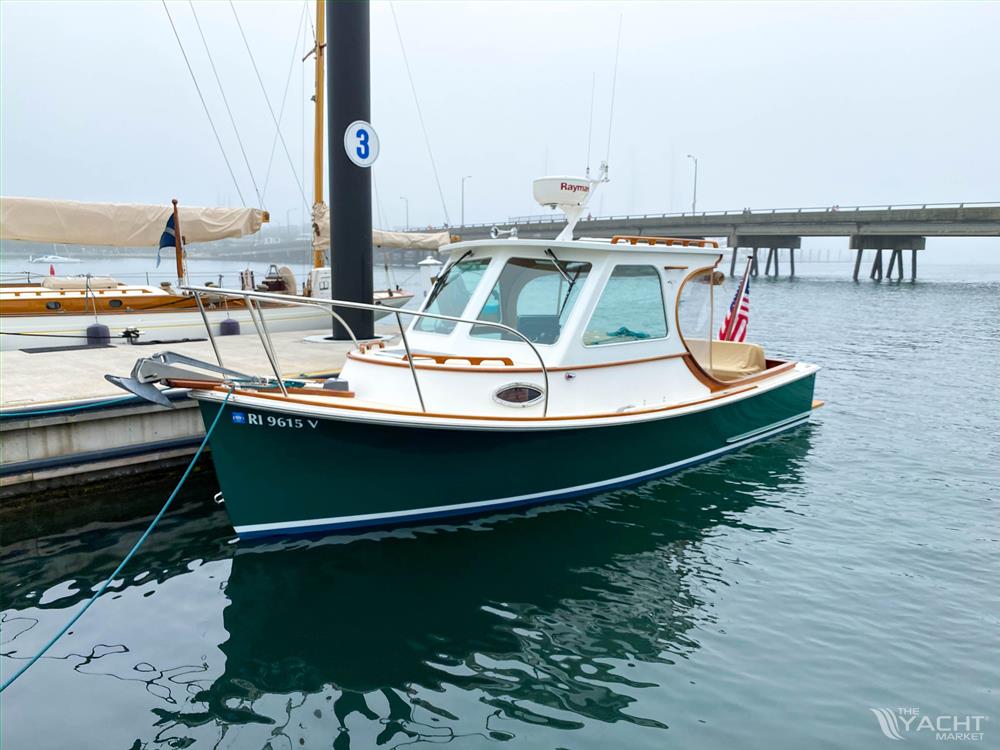 Custom Pemaquid Beach 22 - Custom 2004 Pemaquid Beach 22 boat docked at marina with bridge in background.