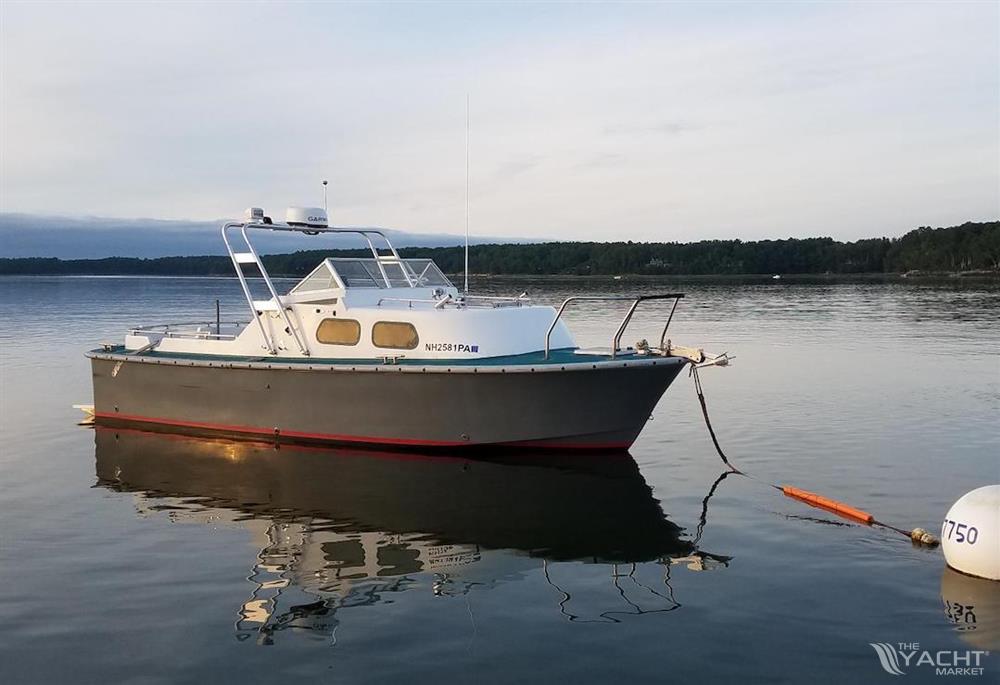 MTI 26-Foot US NAVY Personnel Boat - 1990 MTI 26-Foot US NAVY Personnel Boat anchored on calm water.