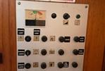 Jeanneau Attalia - Control panel of a 1983 Jeanneau Attalia sailboat with various switches and indicators.