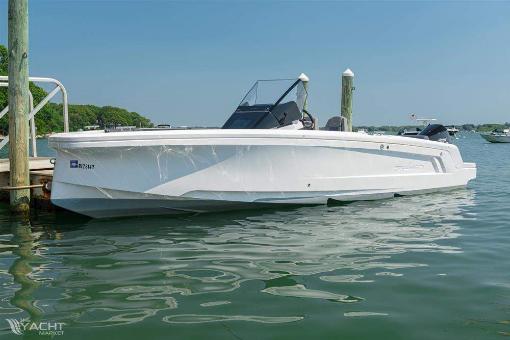 Axopar 22 Spyder - 2021 Axopar 22 Spyder boat docked on calm water.